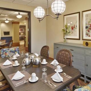 A well-set dining table in a cozy and elegantly decorated dining room.