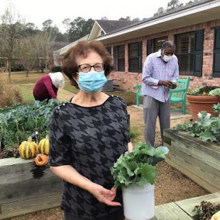 Participants enjoy a community gardening activity, promoting health and sustainability.