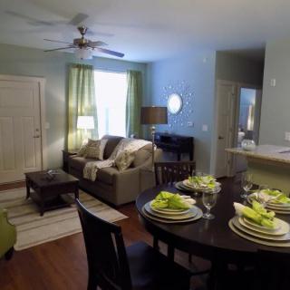 Cozy living and dining area with elegant table setting.