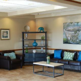 A cozy living room with modern decor and comfortable seating.
