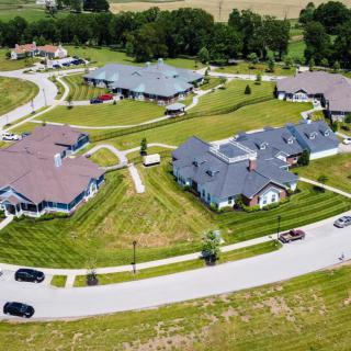 Aerial view of a suburban neighborhood with neatly arranged houses and roads.