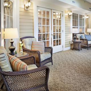 A cozy patio area with wicker furniture and warm lighting.