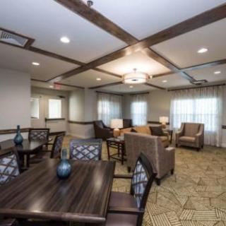 A modern interior room with comfortable seating and decorative lighting.
