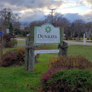 Welcome to Dunkirk - a serene spot with lush greenery and a cloudy backdrop.