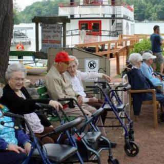 A group of seniors enjoying a day outdoors at the park.