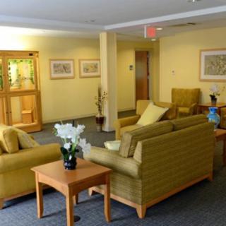 A cozy waiting area with comfortable seating and decorative elements.