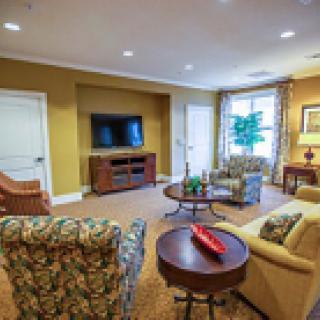 A cozy living room with comfortable seating and a TV.