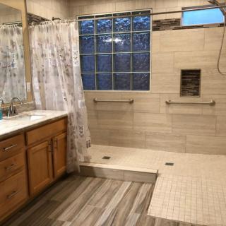 Spacious bathroom with a walk-in shower and double sink vanity.
