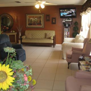 A cozy living room with various seating options and welcoming decor.
