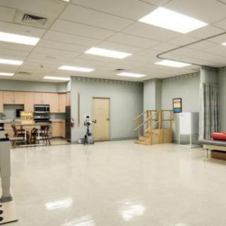 A spacious rehabilitation clinic equipped with exercise and therapy equipment.