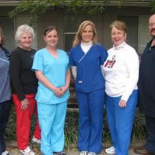 A group of medical staff members standing together outdoors.