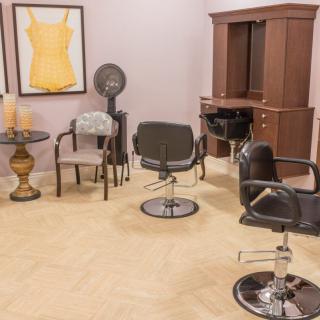 A well-equipped hair salon with multiple styling chairs and stations.