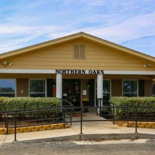 Front view of a bank building with yellow exterior and an entrance sign reading 'Southern Bank'.