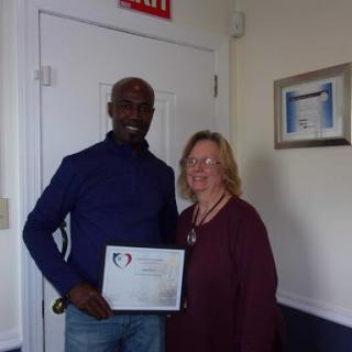 Celebrating an achievement with a certificate presentation.