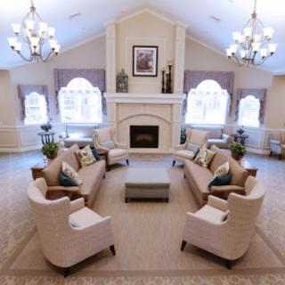 Elegant living room with symmetrical seating and a central fireplace.