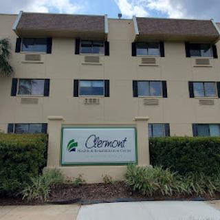View of the Clermont hotel exterior showcasing its signage and landscaping.