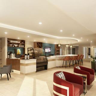 A modern cafe interior with a bar and seating area.