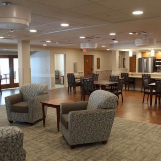 A modern lounge area with comfortable seating and a communal space.