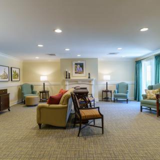 A cozy living room with comfortable seating and soft lighting.