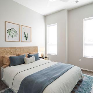 A modern, minimalist bedroom with natural light and stylish decor.