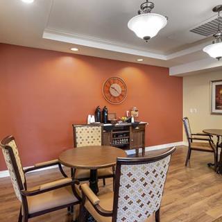 A cozy dining area with warm lighting and elegant furniture.