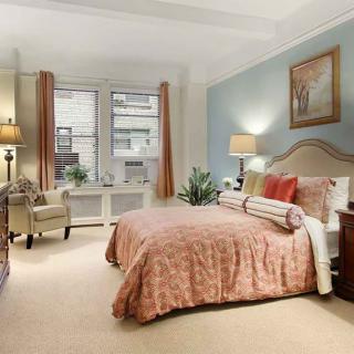 A beautifully decorated bedroom with soft lighting and inviting furnishings.