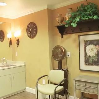 Vintage-style salon interior with cozy furniture and decorative elements.