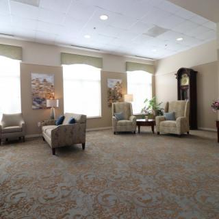 A cozy living room with comfortable seating and large windows.