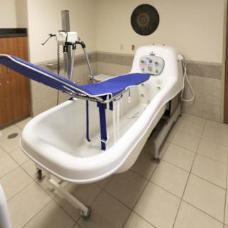 A specialized medical bathtub used in healthcare facilities for patient care.
