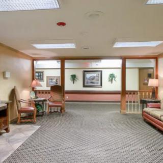 A well-lit lobby area featuring comfortable seating and decorative elements.