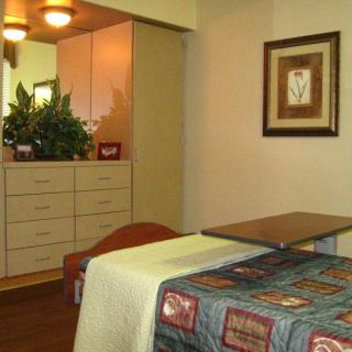 A tranquil massage room with soothing decor and a comfortable massage table.