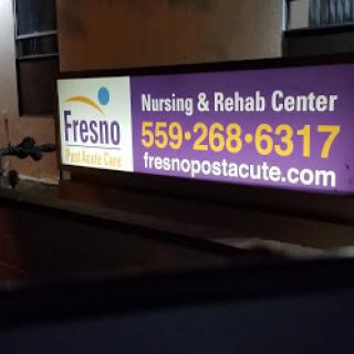 Sign for Fresno Nursing & Rehab Center with contact details.