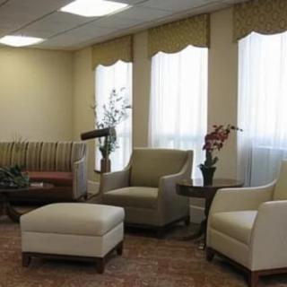A stylish waiting room with comfortable seating and elegant decor.