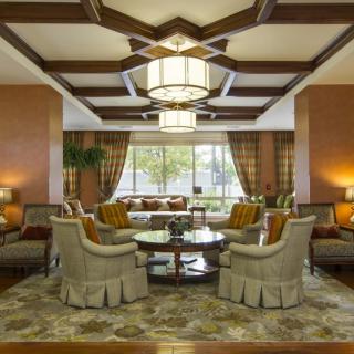 A luxurious living room with elegant furniture and warm lighting.