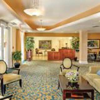 A luxurious lobby featuring elegant seating and a reception desk.