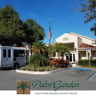 Exterior view of Palm Garden Rehabilitation Center with landscaped grounds and an American flag.