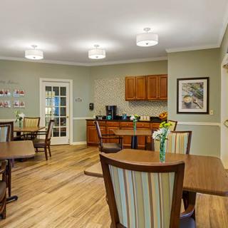 A cozy dining area with modern furniture and warm decor.