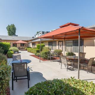 A serene outdoor seating area with sunshades, perfect for relaxation.
