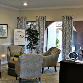 A cozy lobby area with comfortable seating and natural light.