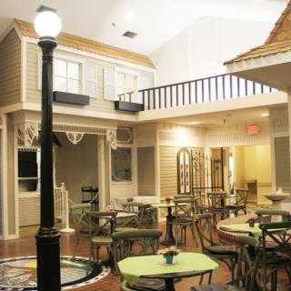 A cozy indoor cafe setting with vintage-style architecture and decor.