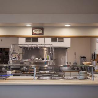 An industrial kitchen with various cooking equipment and utensils on display.
