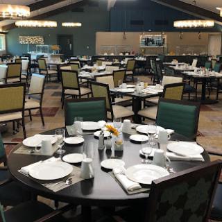 A spacious and elegantly arranged dining area with neatly set tables.