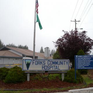 Forks Community Hospital sign, showcasing its location and services.