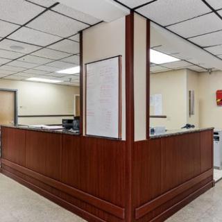 A clean and professional reception desk in an office setting.