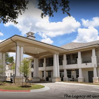 A grand entrance with large columns at a modern building.