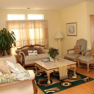 A cozy living room with elegant furniture and warm lighting.