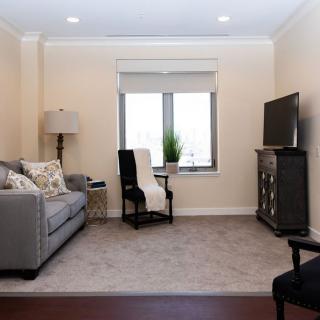 Cozy living room with a comfortable sofa and a TV.