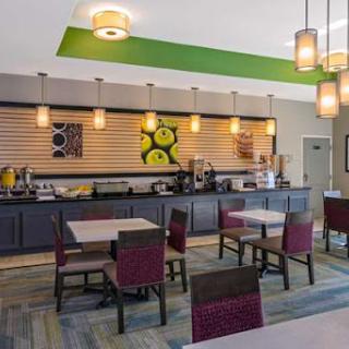 A modern breakfast area featuring inviting furniture and contemporary lighting.