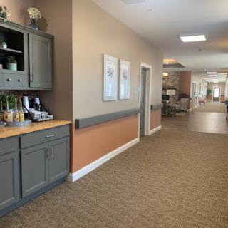 A well-designed hallway in a healthcare facility, showcasing a warm and inviting atmosphere.