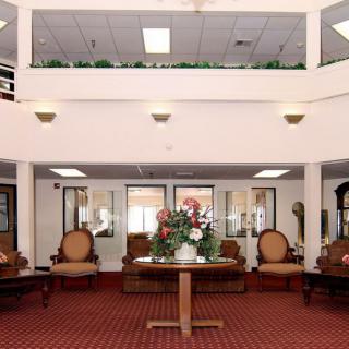 A spacious lobby area with elegant furniture and decor.
